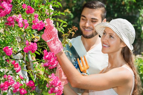 Professional landscaper carrying out safe, insured rubbish removal in Gunnersbury